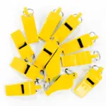 Silbato plástico BEEP. Pack de 12 - Amarillo